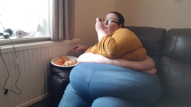SSBBWLadyBrads: SSBBW huge belly whilst eating on sofa