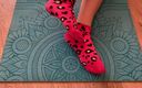 Gloria Gimson: Athletic Girl Doing Leg Exercises in Pink Socks on a...