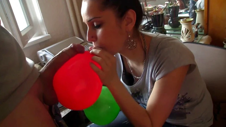 Facial flavor: Adorable brunette licking sperm from balloon