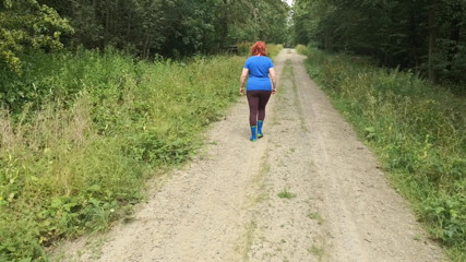 Bouncy Tits Action: Walking in rubber boots