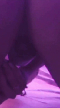Young Girl Using Her Feet to Play with the Dildo While Masturbating