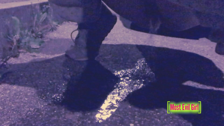 Most Evil Girl: Girl alone at night in a parking lot lowers her...