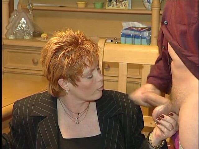 Xfucks: Glamorous redhead mature gives a blowjob in the kitchen