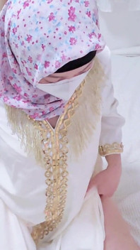 A Malaysian Hijabi Girl Teasing with White Abaya Showing off Her Ass