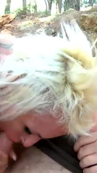 Slut with big tits loves sucking two cocks at once