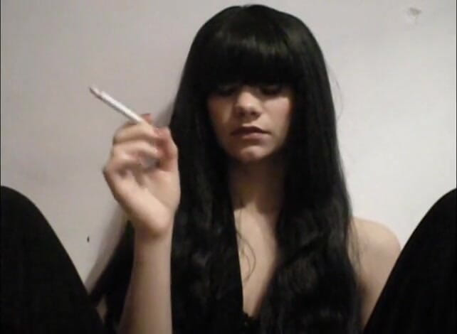 Femdom Austria: Long haired bitch smoking a cigarette
