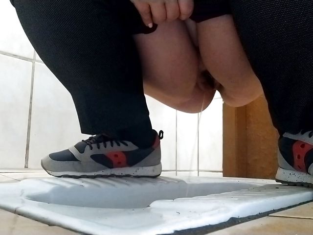 Curvy milf pissing in a dirty public toilet. (SoloRussianMom)