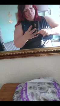 Showing off in a cool lab coat in front of the mirror