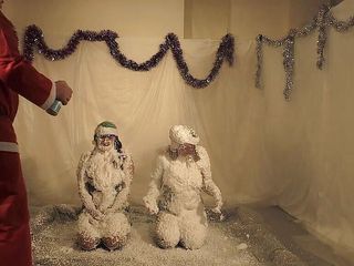 Gunked up girls: Christmas elves Lola and Jodie snow