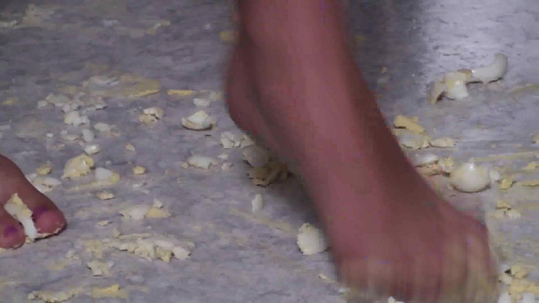Foot Girls: Brunette crushing food in the kitchen
