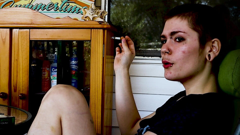 Vibra King Video: Shaved Head Goth Smokes Outside