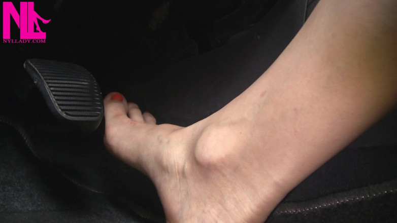 Nyllady: Nyllady with Her Bare Foot on Gas Pedal Driving