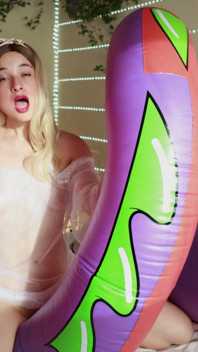 A Sexy Girl Rides an Inflatable Snake in Provocative Lingerie