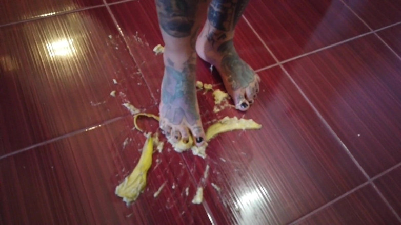 Fetish videos by Alex: A Banana Is Trampled by a Blonde Tattooed MILF