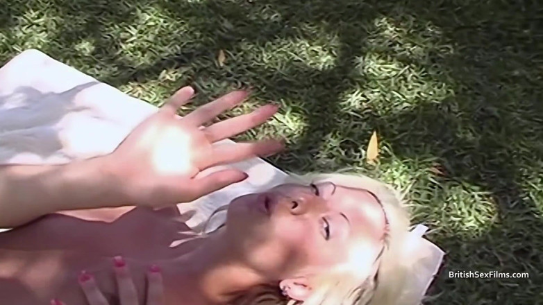British Sex Films: Pretty blonde enjoys her own pussy in the sun