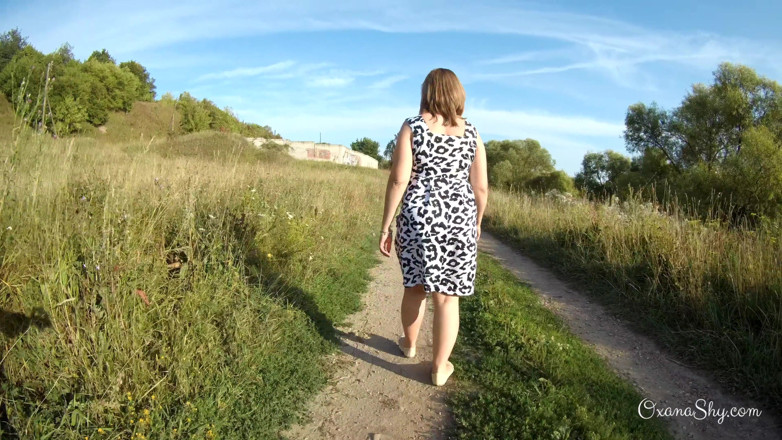 MILF Oxana: Flashing and naughty fun at the riverside