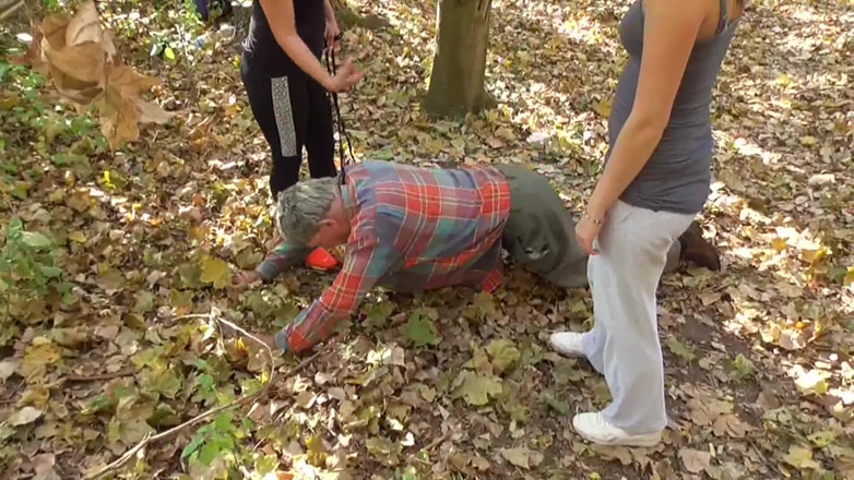 Femdom Austria: Training their old pet slave in the forest