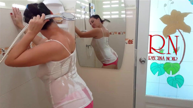 Regina Noir: The girl bathes in a shower in a T-shirt and...