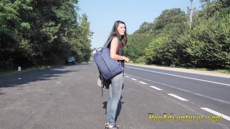 Pee Adventures: Skinny brunette hitchhiking with her bladder full