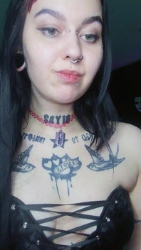 Sexy Alternative Brunette Drinking Sparkling Water and Burping