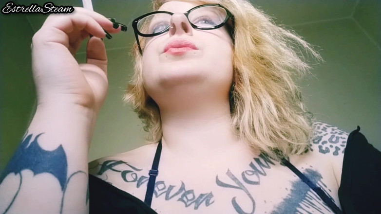Estrella Steam: Blonde smokes a cigarette NO AUDIO