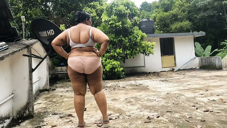 Anne Ipe: A Full-figured Woman in a White Skirt and Pink Top...