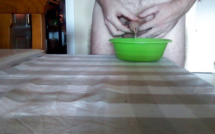 Sex hub male: John is peeing into a green bowl on the table