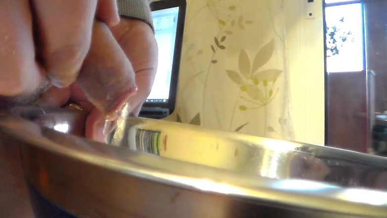 Sex hub male: Closeup of John peeing into a steel bowl