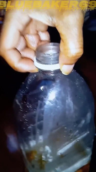 Pissing in a Large Juice Container