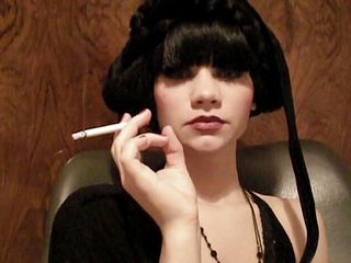 Femdom Austria: Glamorous beauty smoking a cigarette