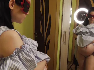 Anna Sky: Pregnant Anna trying on dresses in front of a mirror