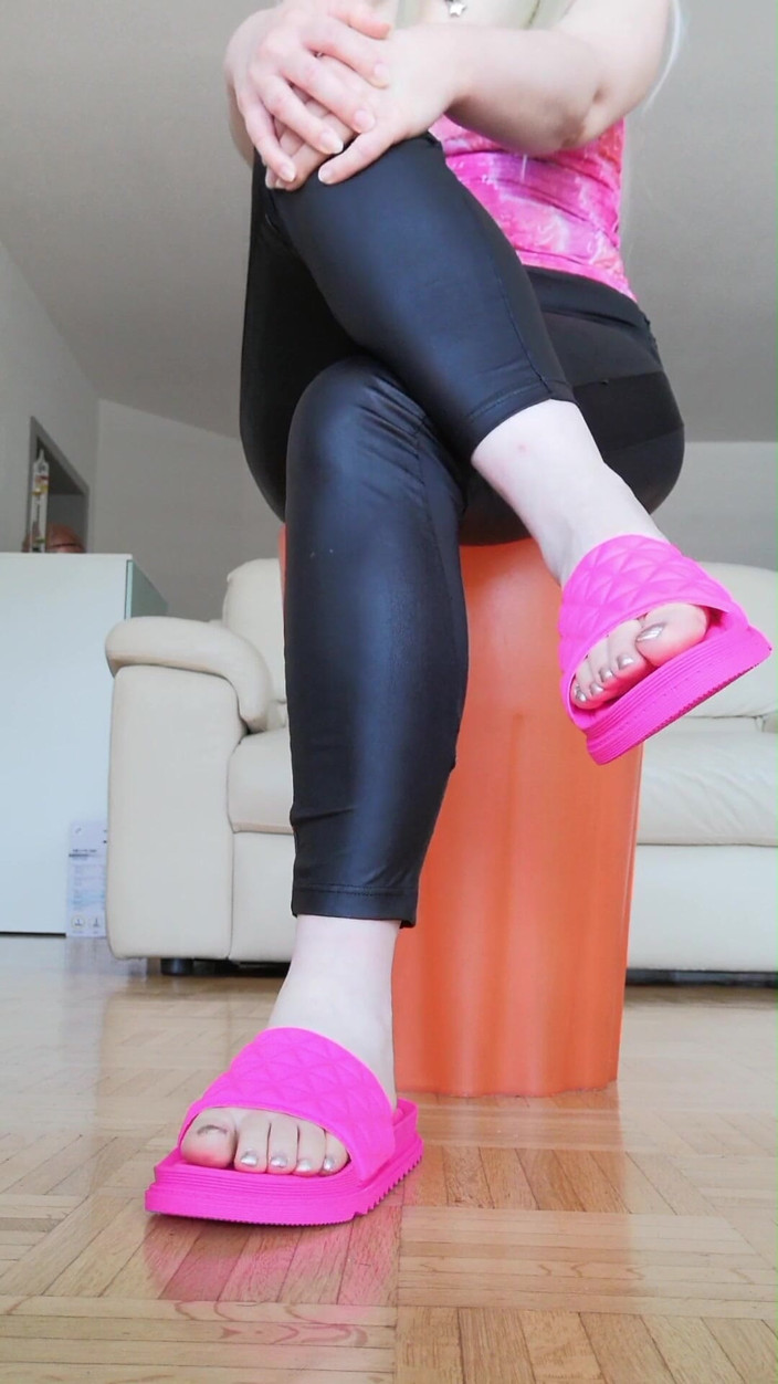 RavenBigAss: Raven: Toe-tapping with Crossed Legs Latex Trousers and Fuchsia Slides