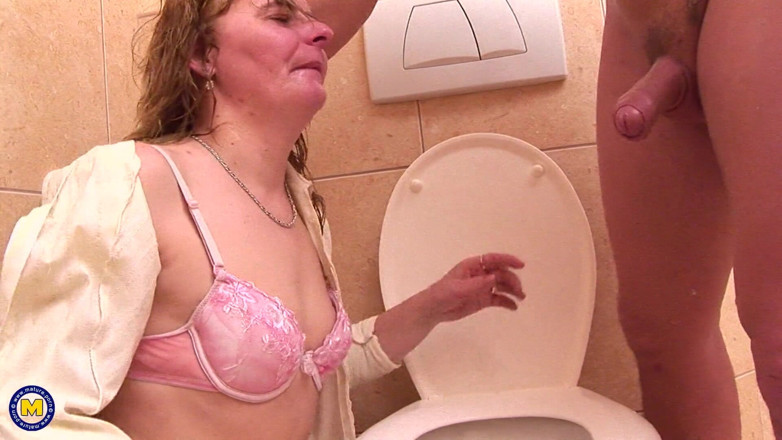 Mature NL: While Taking a Piss, She Licks Ass and Sucks Cock
