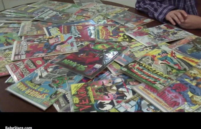 Babe Stare: Misty shows off her comics collection naked