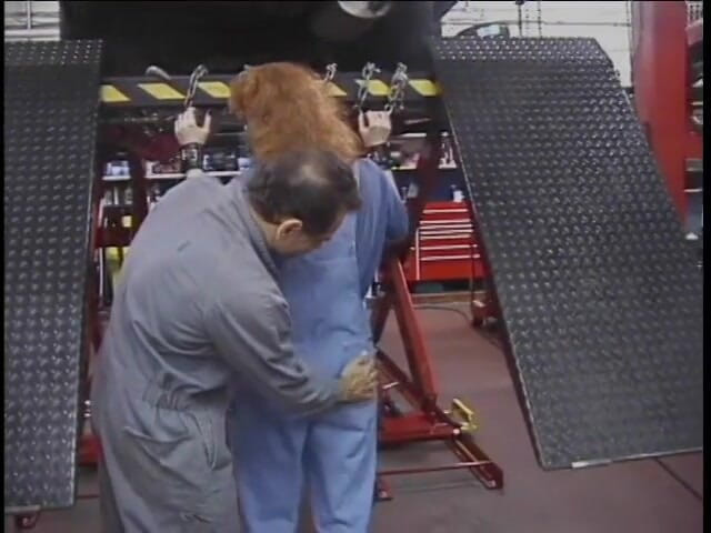 Sex Karma: Brunette joins mechanic and fondles redhead's ass