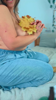 A Big Smile From a Beautiful MILF with Leaves