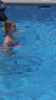 Lesbian Girls Are Having Fun in a Pool with an Inflatable Shark