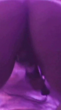 Young Girl Using Her Feet to Play with the Dildo While Masturbating