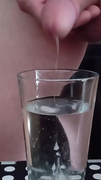 Cumming in a glass of hot water 