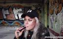 Fetish Videos By Alex: Blonde lady smokes an electronic cigarette on stair