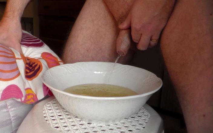 Sex hub male: John is peeing into a porcelain bowl