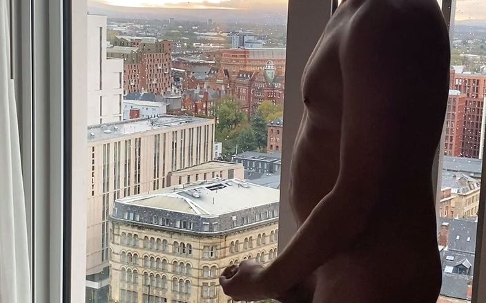 Robs Nudes: Exhib jerk off and cum over cityscape view.