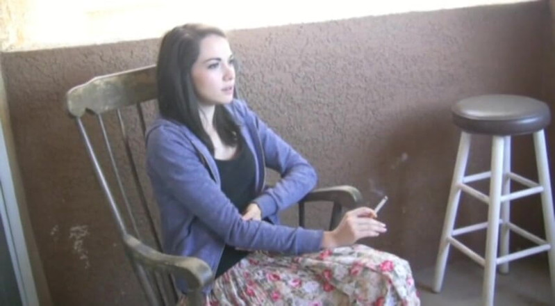 Femdom Austria: Cute brunette teen smoking a cigarette