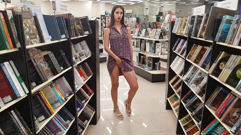 Sweet Buttocks: Woman in a Bookstore Shows Her Pussy and Ass