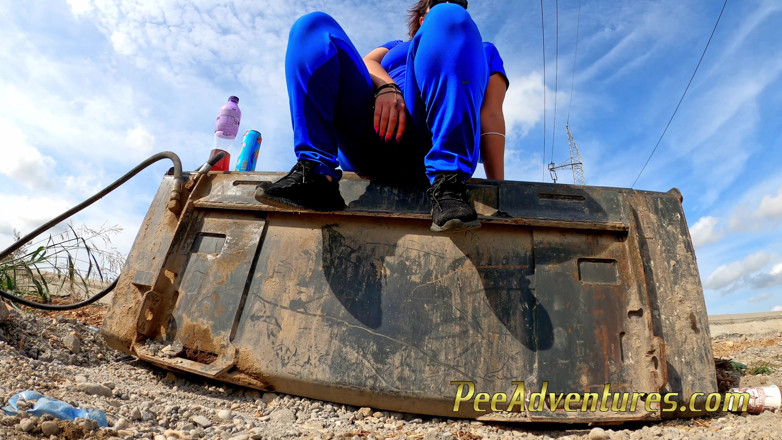 Pee Adventures: Chubby brunette pee on this excavator bucket