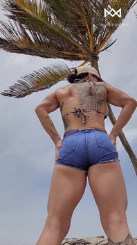 Giant Muscular Goddess on the Beach