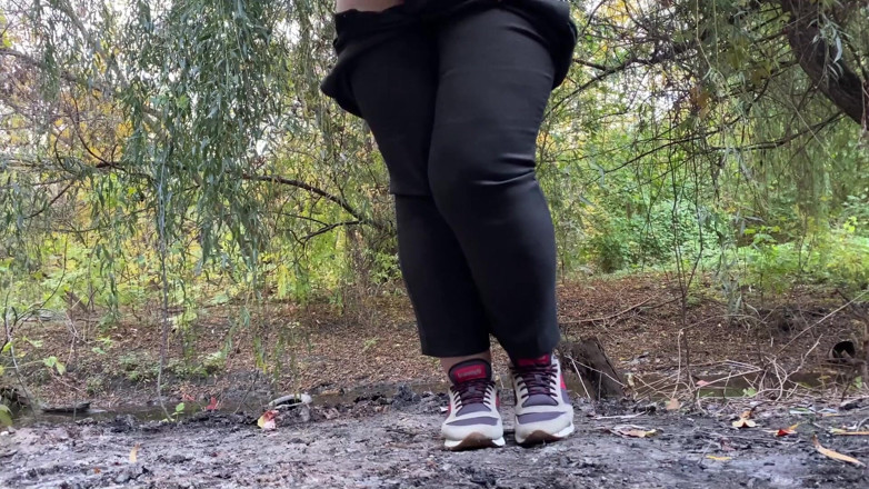 Elena: MILF dressed in pants pissing outdoors