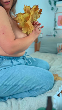 A Big Smile From a Beautiful MILF with Leaves