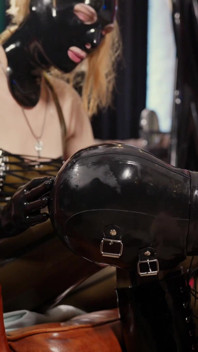 Male Slave Adoring His Mistress' Shiny Boots