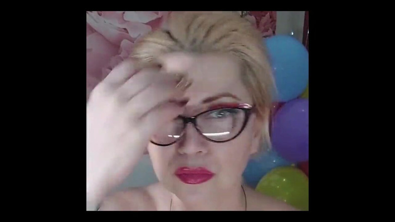 AimeeParadise: Dildoing of a Mature Bitch on a Background of Colorful...